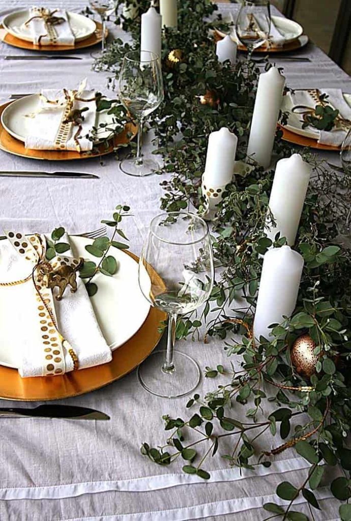 Australian native foliage and burnished copper plates - table setting.