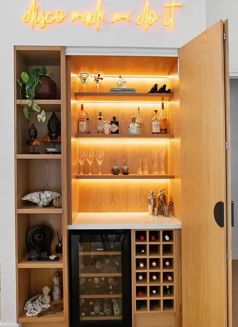 Drinks cabinet customed designed by an interior designer and featuring integrated lighting