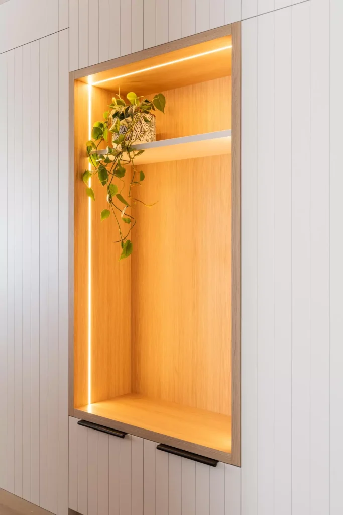 Recessed entry way shelving with integrated lighting