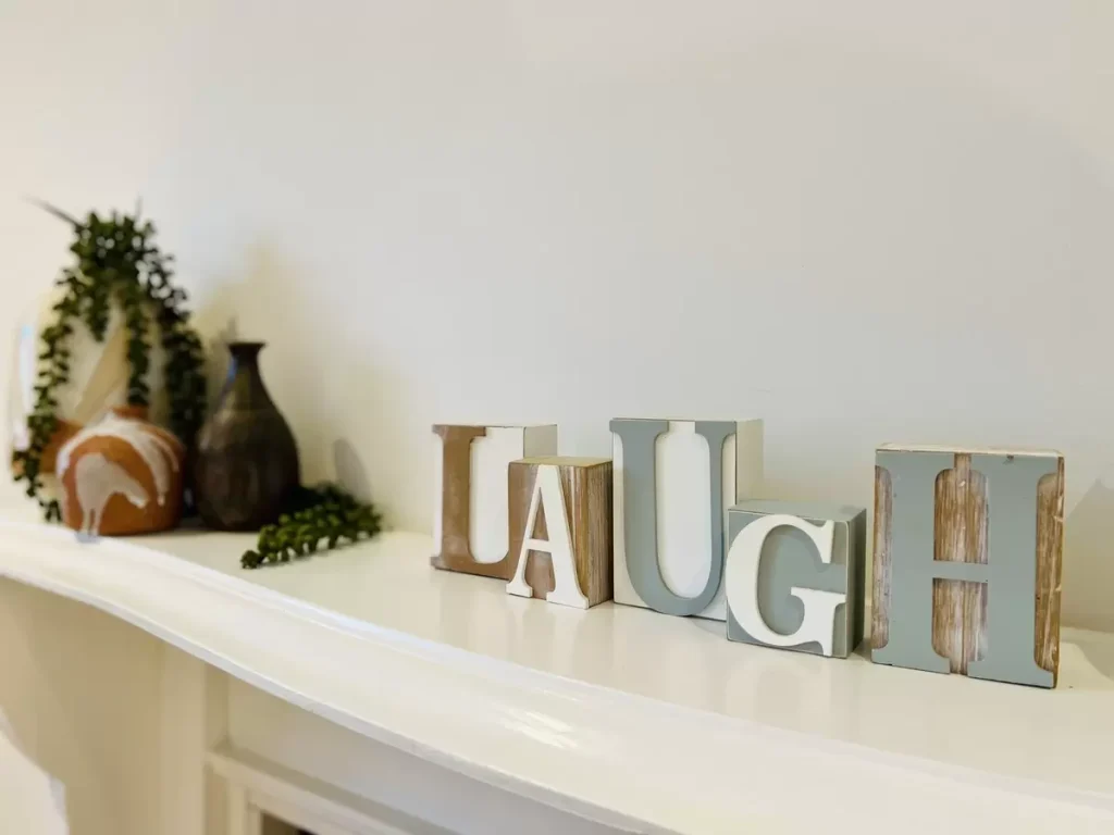 Wooden blocks spelling laugh