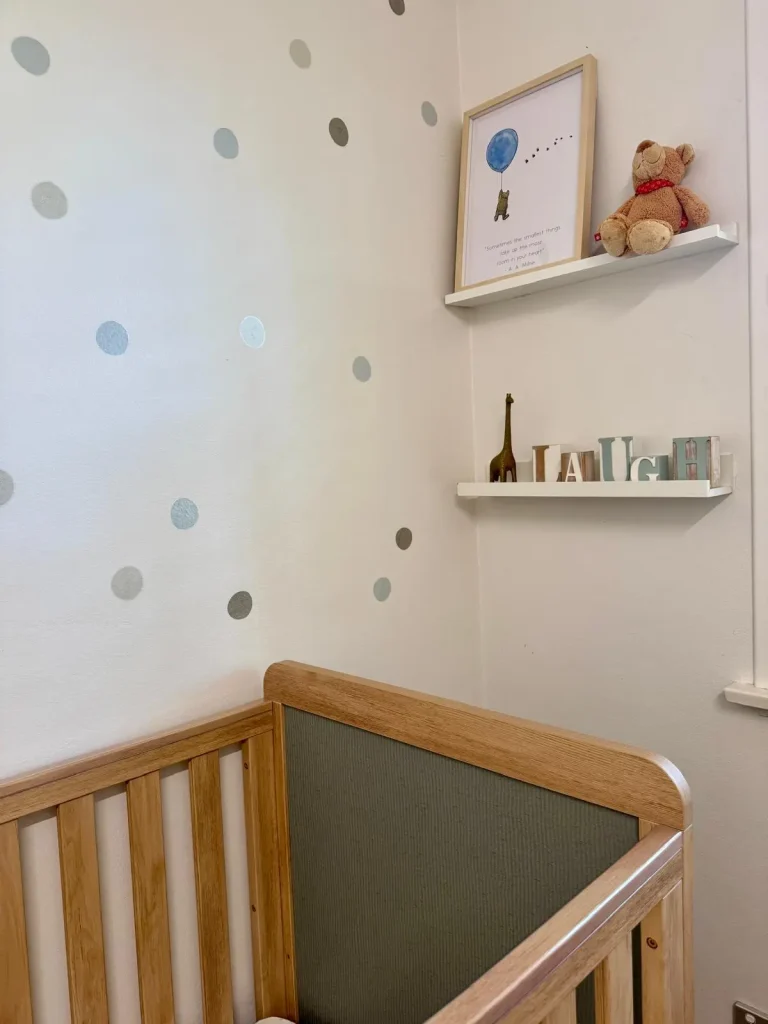 wall decals and shelves in a beautifully styled nursery