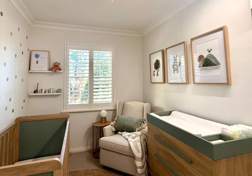 Beautifully styled nursery including cot change table / drawers and nursing chair