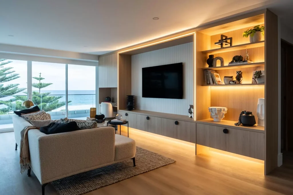 custom media wall with storage in a full apartment renovation in Manly